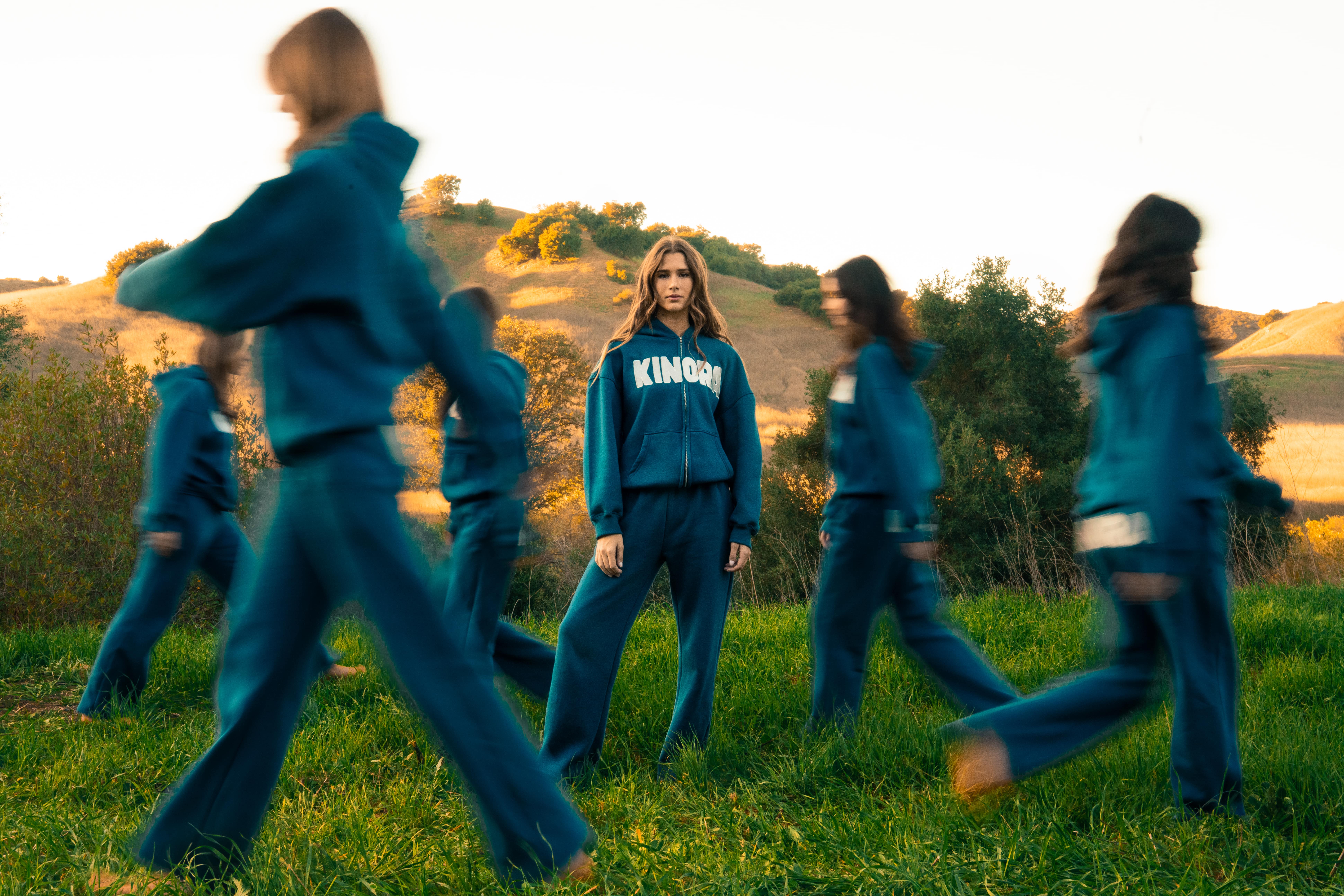 ladies in Kinora sweatpants in a field of grass